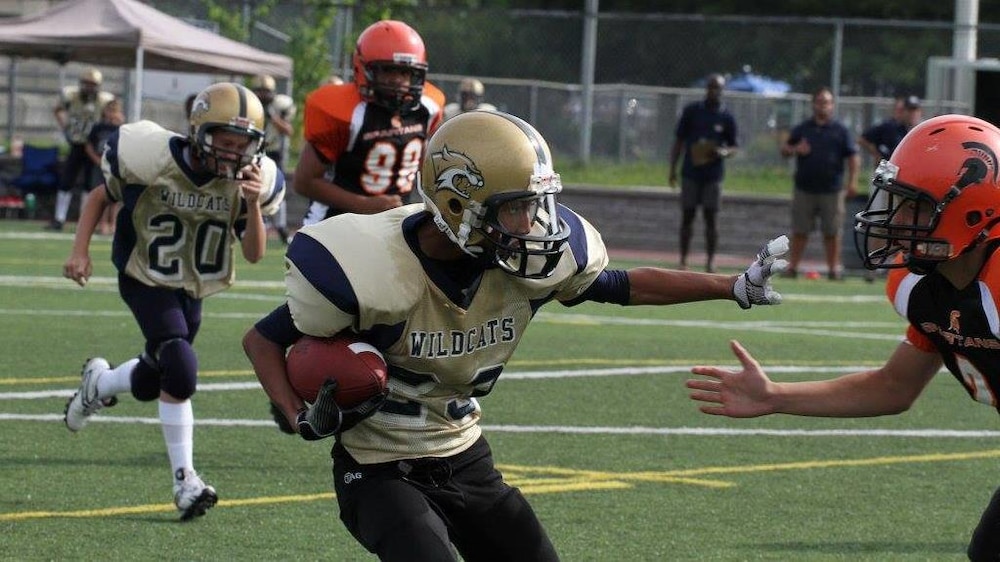 Benjamin St-Juste (en avant-plan) à 12 ans avec les Wildcats de Laurentides-Lanaudière, sur le terrain situé à Blainville.