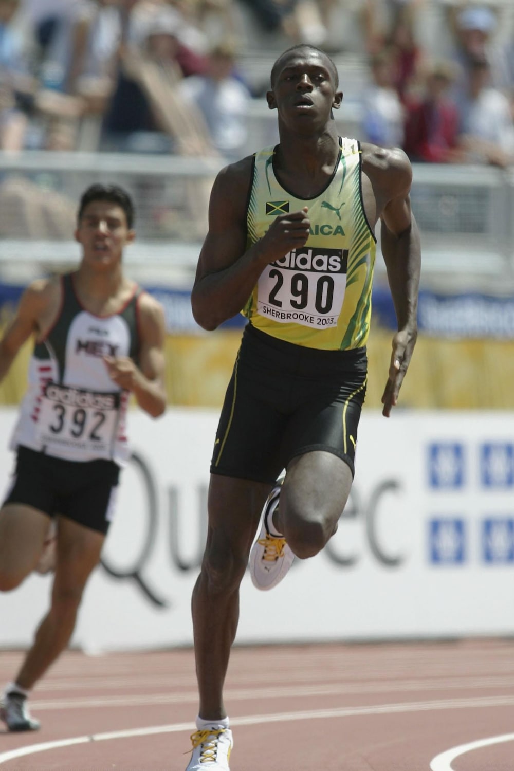 Usain Bolt (en jaune) le 10 juillet 2003 dans sa vague de qualifications du 400 m aux Championnats du monde jeunesse de Sherbrooke
