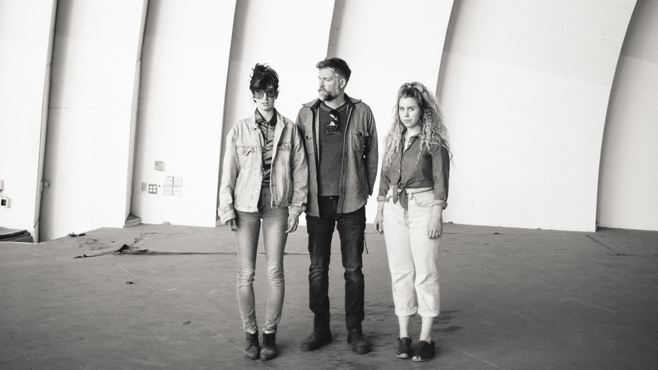 Lisa Conway poses with her bandmates Andrew Collins and Mary Wood.