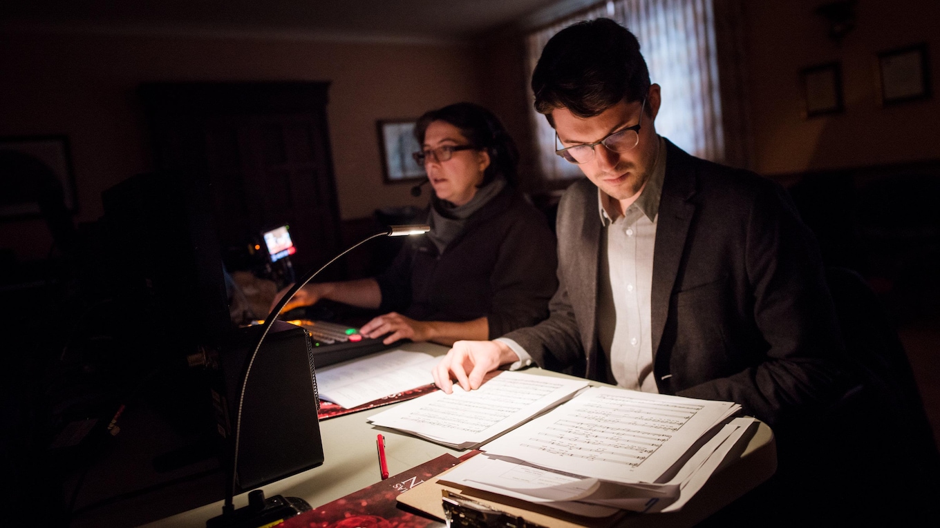Backstage, CBC's Chris Maskell assists switcher Julie Lapierre with the video mix at the 2017 CBC Christmas Sing-In in Montreal.