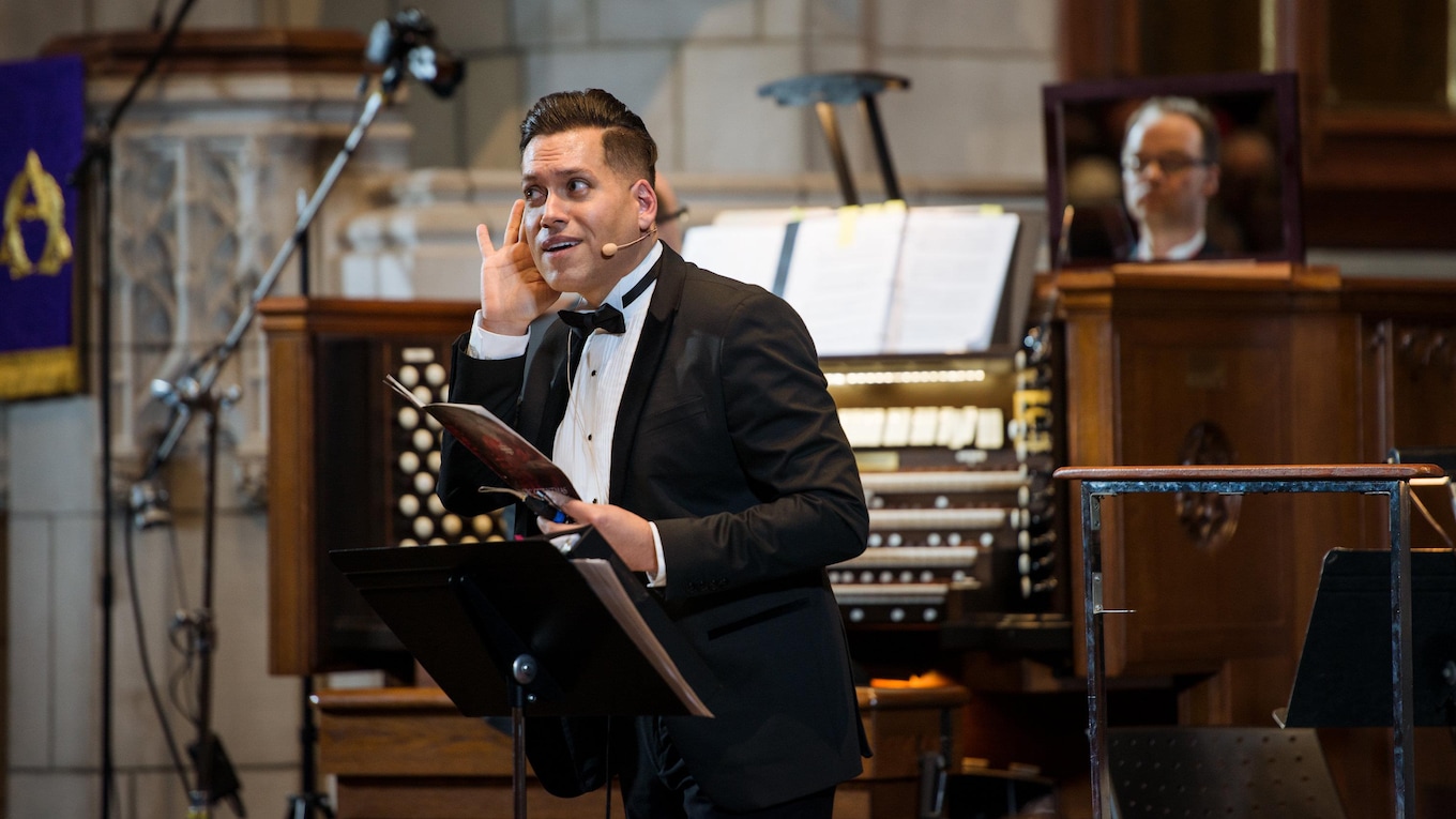 Conductor Jean-Sébastien Vallée runs a choral boot camp with the audience at the 2017 CBC Christmas Sing-In in Montreal.