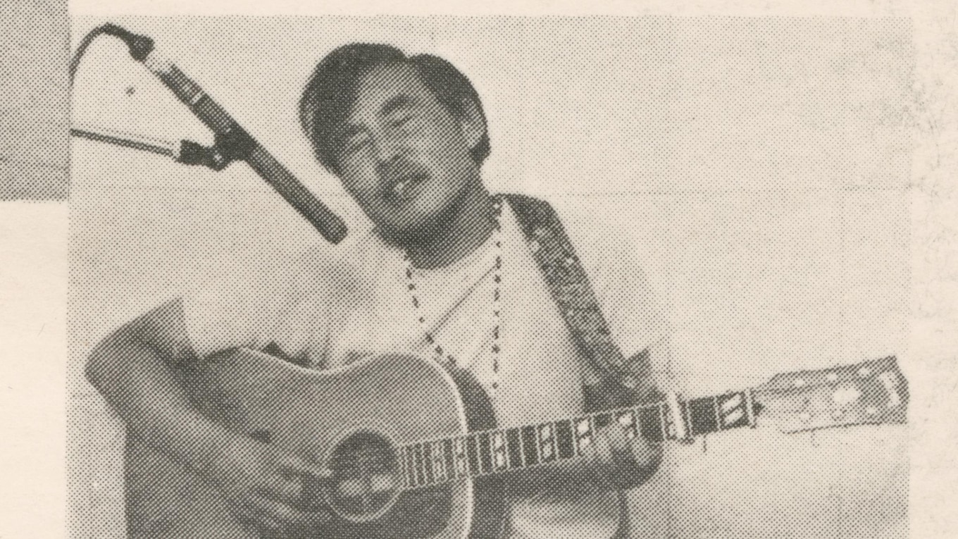 John Angaiak playing the guitar.