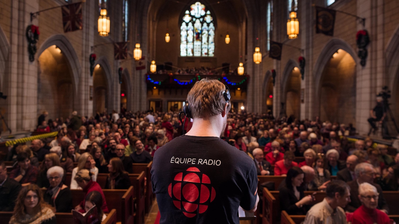 CBC recording technician Sébastien Heppell makes final adjustments prior to the start of the 2017 CBC Christmas Sing-In in Montreal.