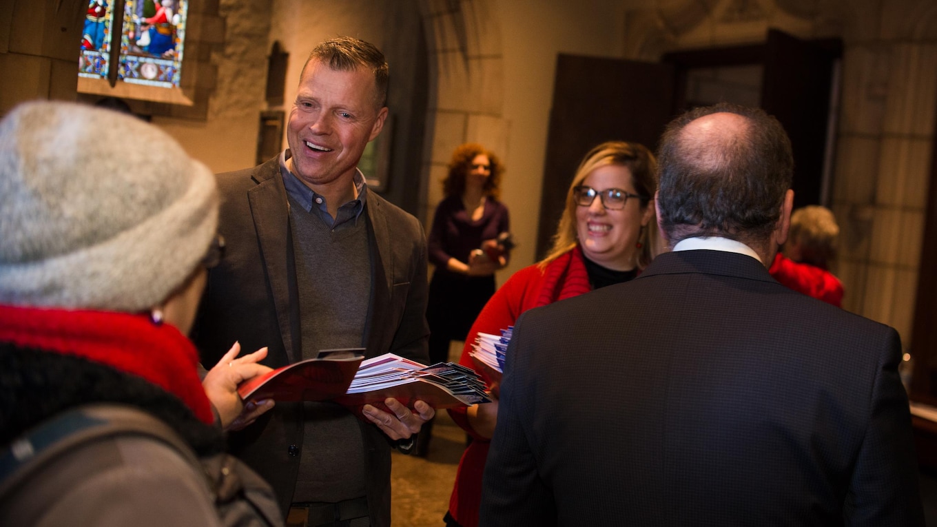 Mike Finnerty, host of Daybreak on CBC Radio One in Montreal, greets the public with a smile. He is one of the readers on this year's program.