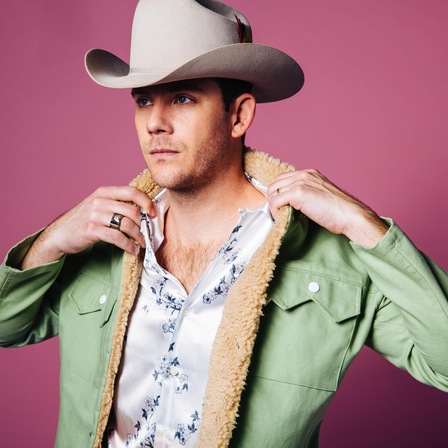 A press photo of Sam Outlaw.