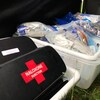 Des trousses de naloxone et du matériel nécessaire à l'injection sécuritaire de drogue reposent dans des bacs sur une photo non datée.