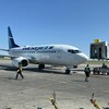 Un avion de WestJet à l'aéroport international John G. Diefenbaker de Saskatoon, en Saskatchewan, le 18 mai 2023.