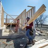 Charles Rochfort, left, and Jonathan Grenier work on a home as Quebec lifts the ban on residential construction due to the COVID-19 pandemic Monday April 20, 2020 in Deux-Montagnes, Que.. THE CANADIAN PRESS/Ryan Remiorz