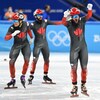 Trois patineurs canadiens festoient.