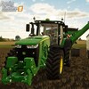 Une capture d'écran tirée du jeu vidéo Farming Simulator montrant un tracteur John Deere en train de récolter des grains dans un champ et de les déverser dans une remorque située à côté de lui.