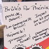 Pancarte d'un manifestant mécontent du système de paye Phénix.