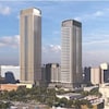 Image générée par ordinateur montrant deux tours d'habitation dans une zone urbaine.