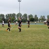 Des joueurs de soccer sur le terrain à Rimouski, en été.