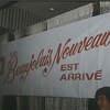 Affiche avec le logo de la SAQ où il est écrit : Le Beaujolais nouveau est arrivé.
