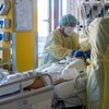 Intensive care nurses treat a severely ill COVID-19 patient. Across Manitoba, hospitals are filling up and doctors say the province is running out of resources to treat critically ill patients.