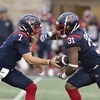 Montreal Alouettes quarterback Cody Fajardo (7) hands off the ball to running back William Stanback (31) during first half CFL pre-season football action agaisnt the Hamilton Tiger-Cats in Montreal on Friday, June 2, 2023.  THE CANADIAN PRESS/Christinne Muschi