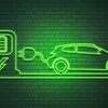 Un néon vert représente une voiture électrique qui se recharge à une borne.