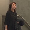 Nathalie Normandeau dans un corridor du palais de justice