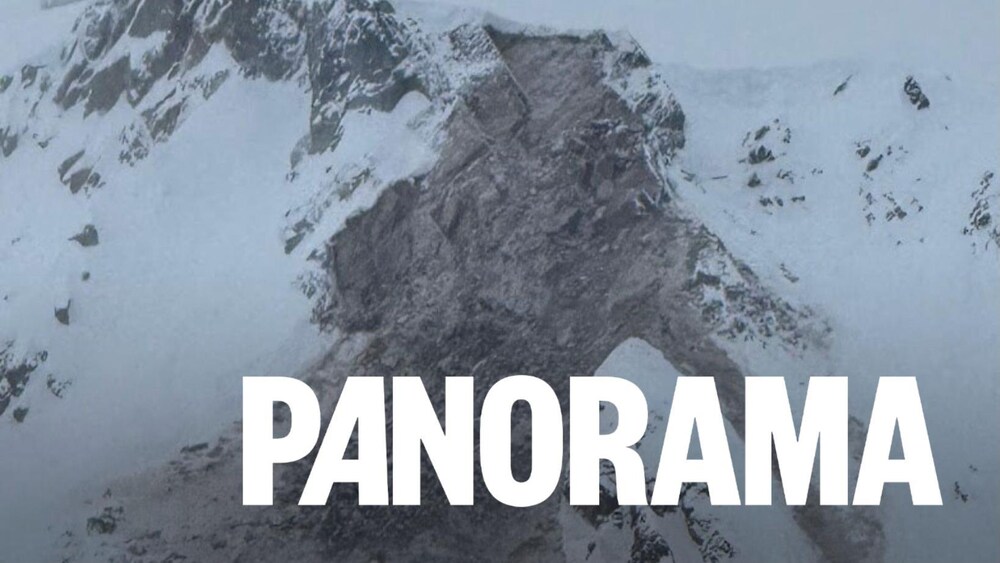 Un flanc de montagne enneigé déchiré par un éboulement.