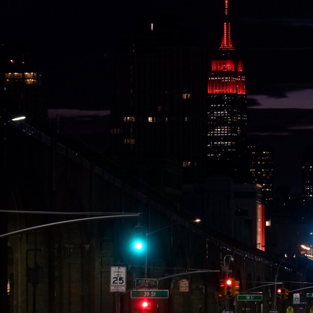 The Empire State Building lit up in red to honor New York's healthcare workers. 