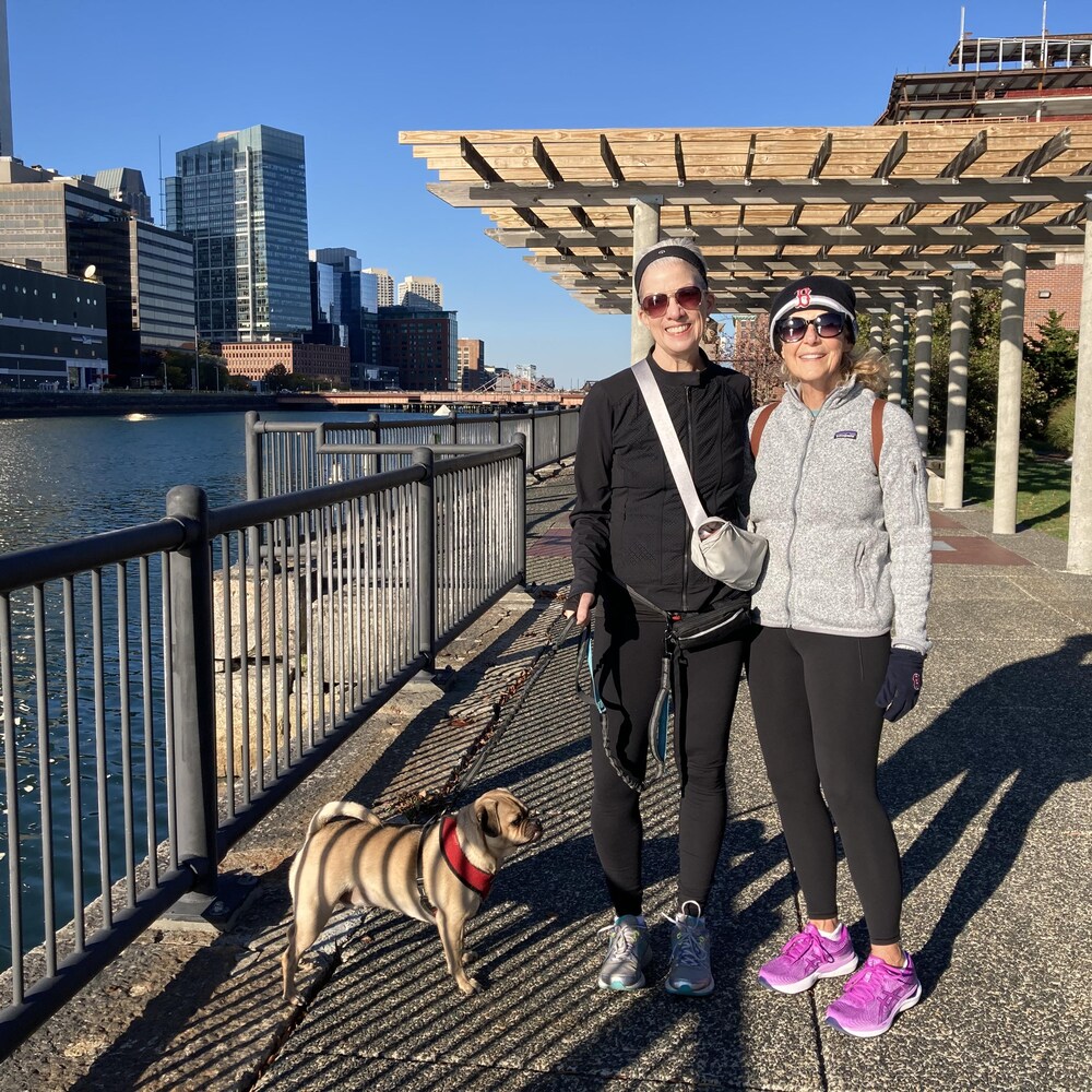 Two women with their dog.