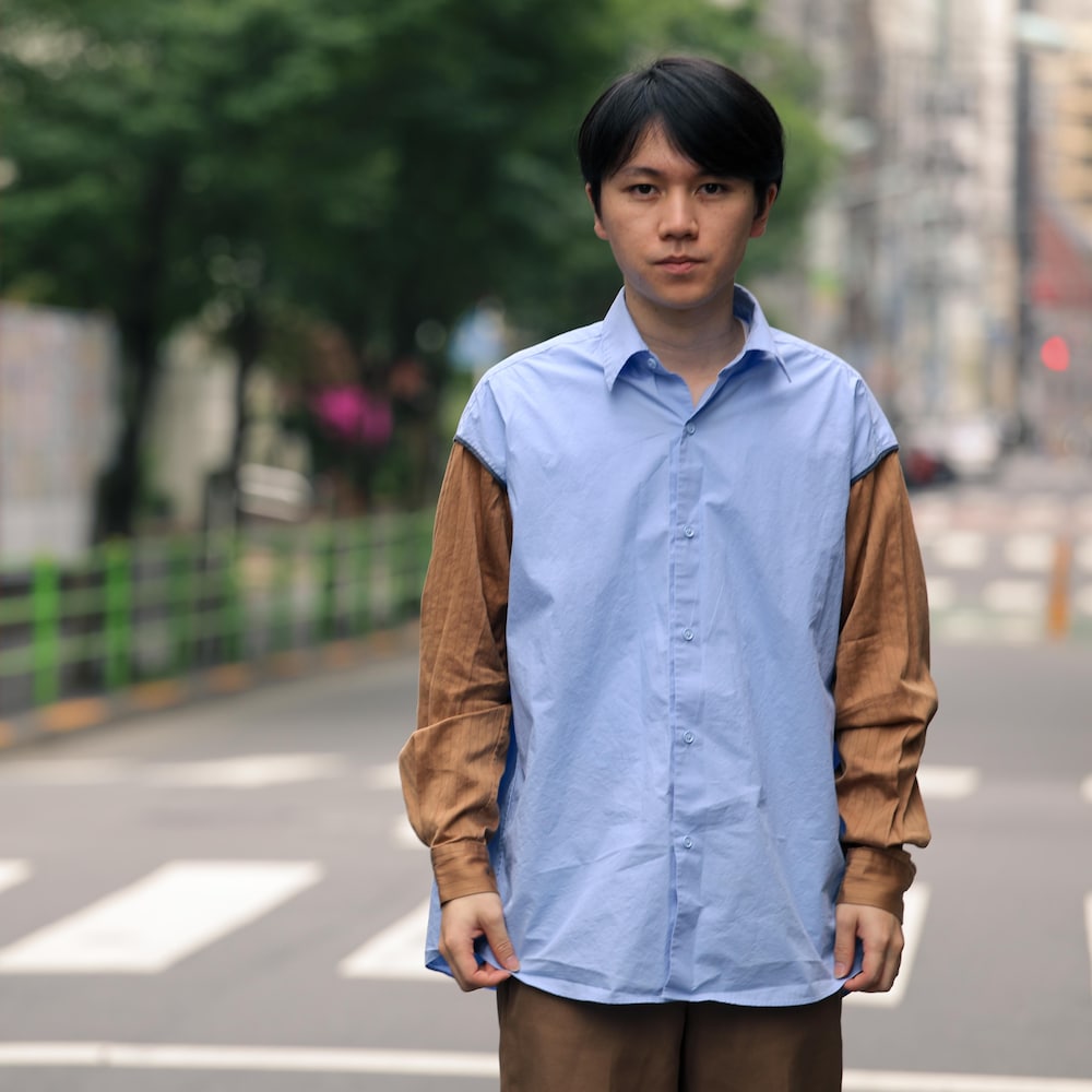 Portrait de Koki Ozora devant une rue.