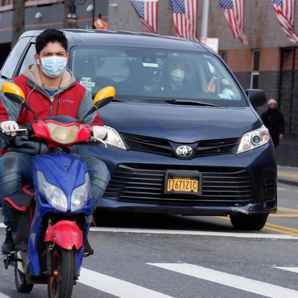 New Yorkers wearing masks.