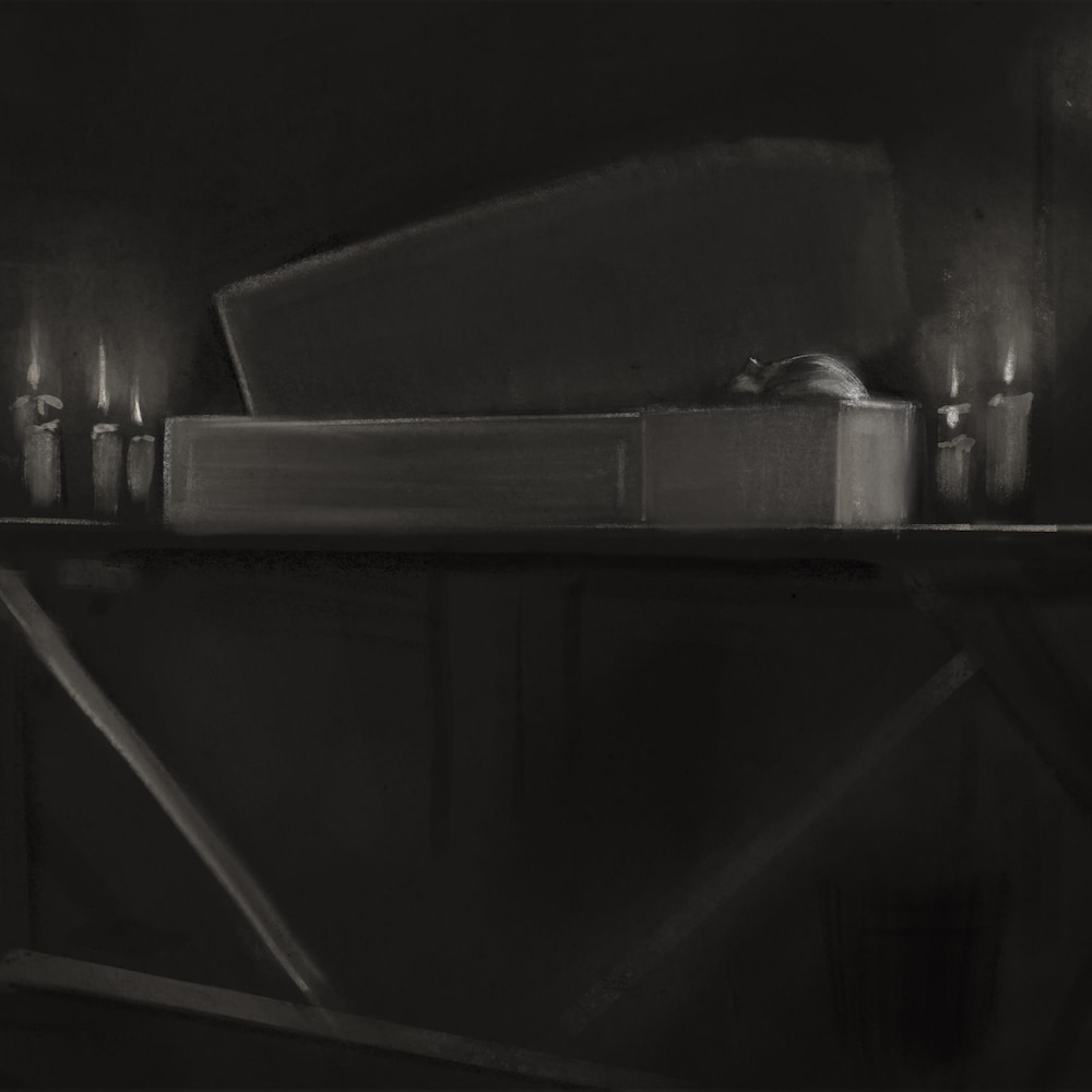 Un dessin d'un petit cercueil entouré de chandelles. 