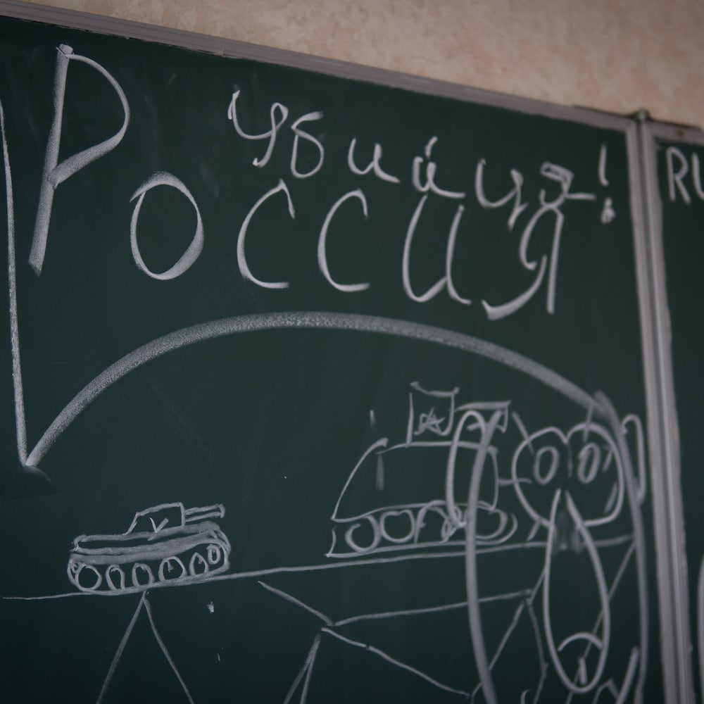 Cyrillic writings drawn in chalk.
