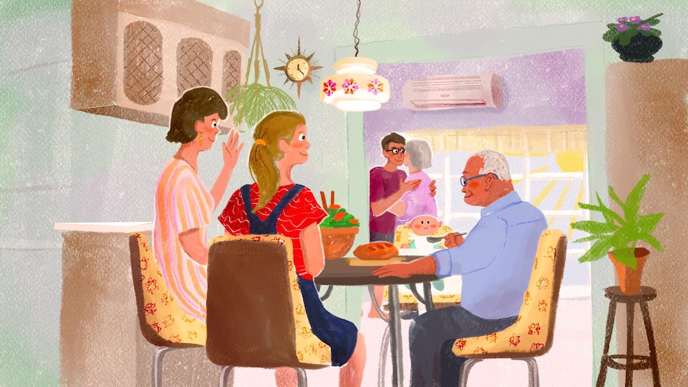 Une famille se réunit autour de la table pour le dîner.