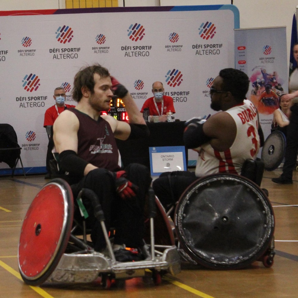 Two athletes compete for the ball.