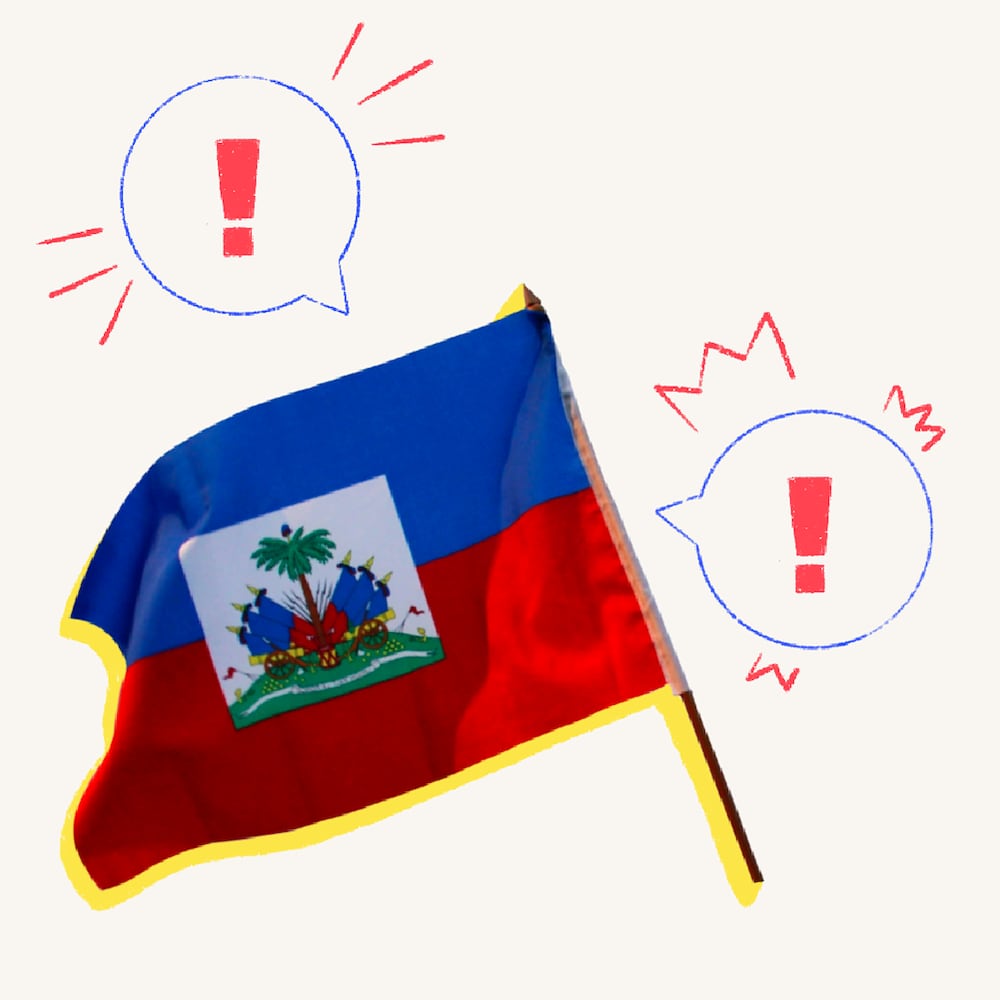 Un drapeau d'Haïti (deux bandes horizontales d'égale hauteur sur lequel est apposé un rectangle plus petit qui contient le blason du pays). Il s'agit du drapeau utilisé avant 1986. Le drapeau est entouré de bulles de texte dessinées, dans lesquelles des points d'exclamation se trouvent.