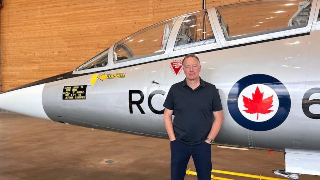 Stephen Fuhr, head of Canada's Defence Procurement Agency, stands in front of a CF-104D Starfighter, built in 1962, at the KF Centre for Excellence in Kelowna, B.C.