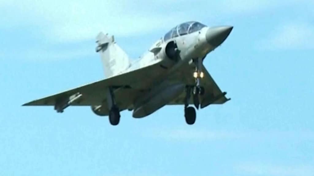 In this image taken off video, a Taiwan fighter jet prepares to land at the Hsinchu Airbase in Taiwan on Monday, Dec. 29, 2025. (AP Photo/Wu Taijing)