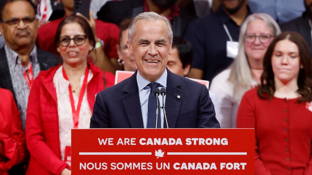 Mark Carney is all smiles on stage with his supporters.