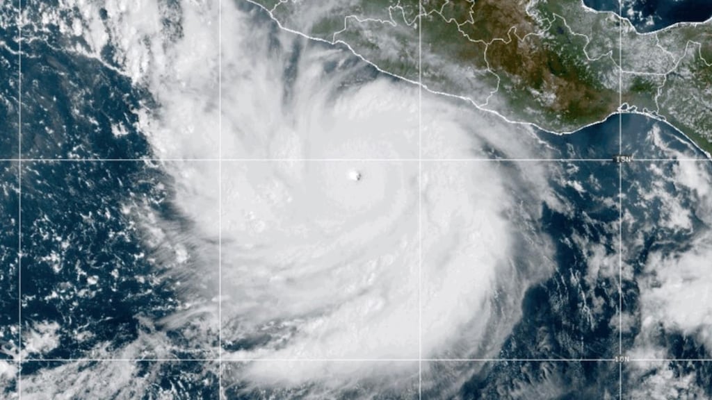 This photo provided by National Oceanic and Atmospheric Administration shows Hurricane Polo strengthening in the Pacific Ocean off the coast of Mexico on Tuesday.