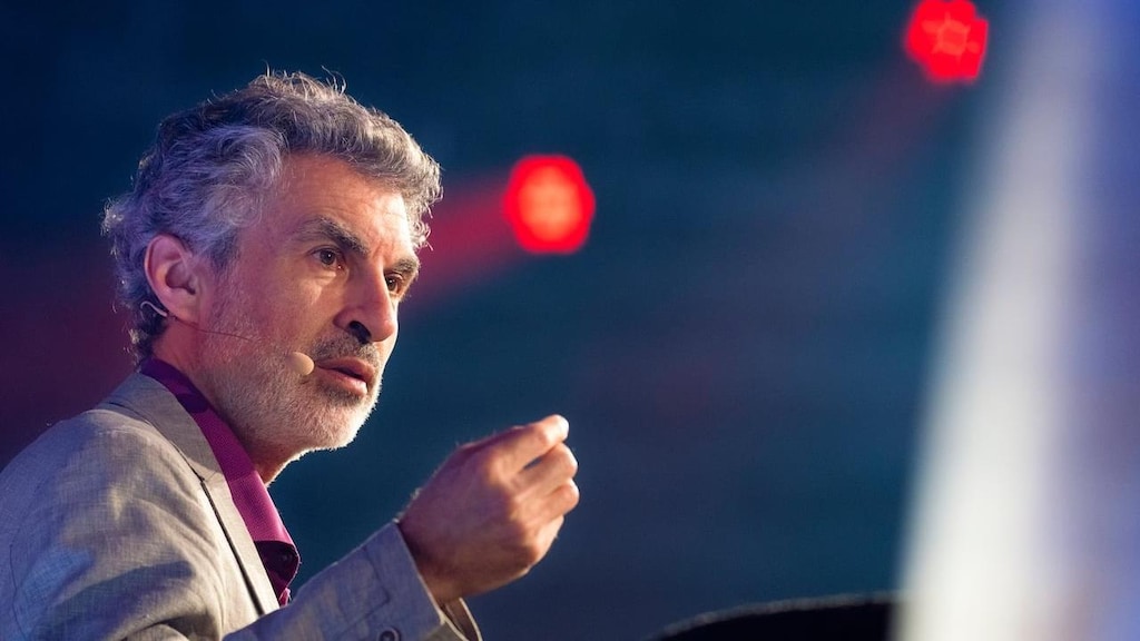 A man gives a conference.