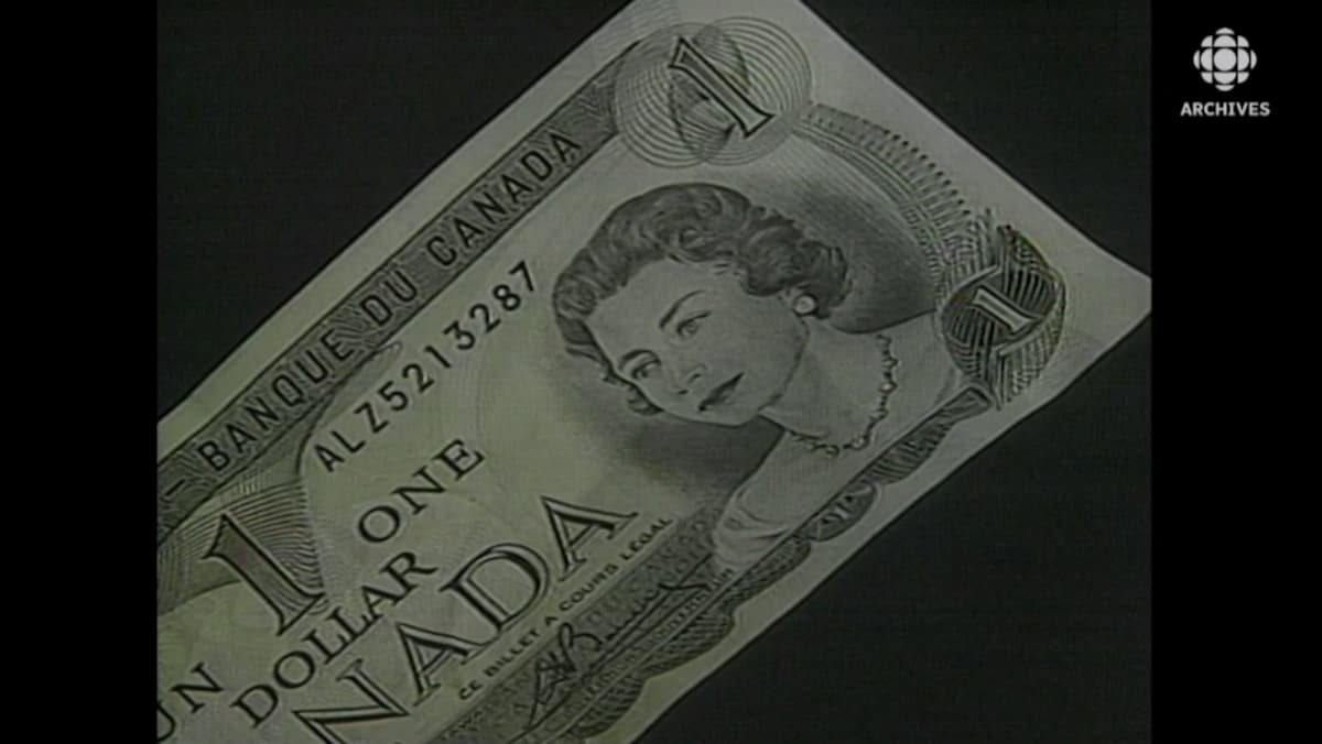 Gros plan d'un billet d'un dollar avec le portrait de la reine Élisabeth II.