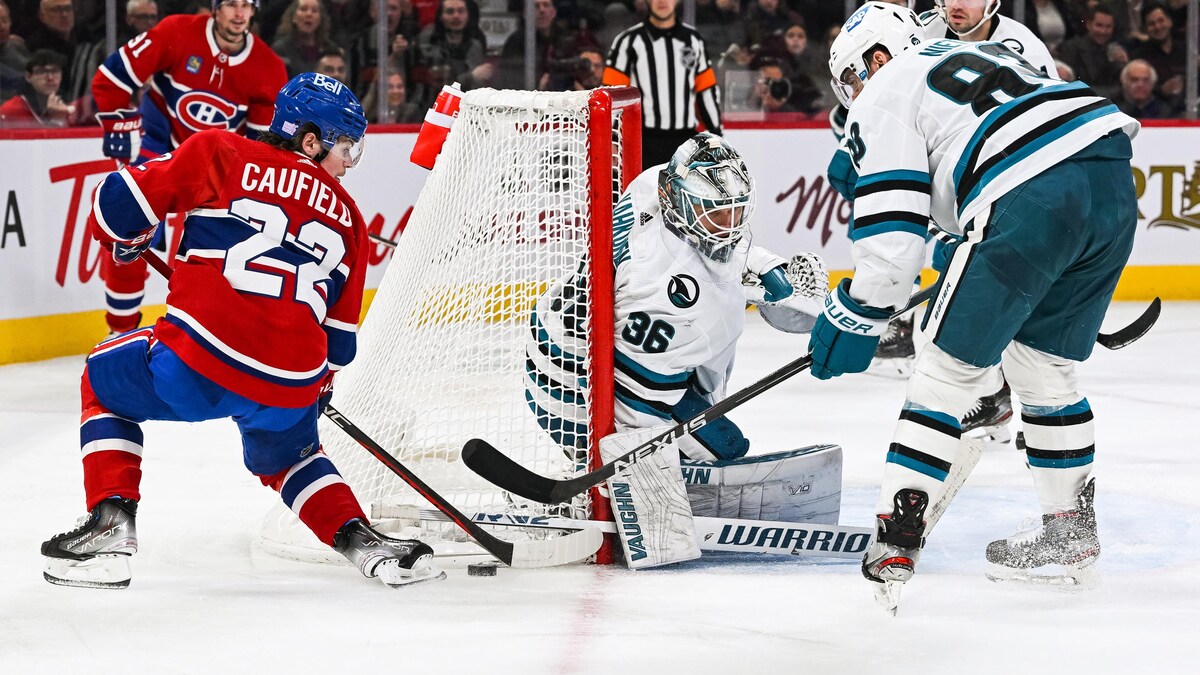 Nov 29, 2022; Montreal, Quebec, CAN; Montreal Canadiens right wing Cole Caufield (22) misses his shot on San Jose Sharks goalie Kaapo Kahkonen (36) during the second period at Bell Centre. Mandatory Credit: David Kirouac-USA TODAY Sports