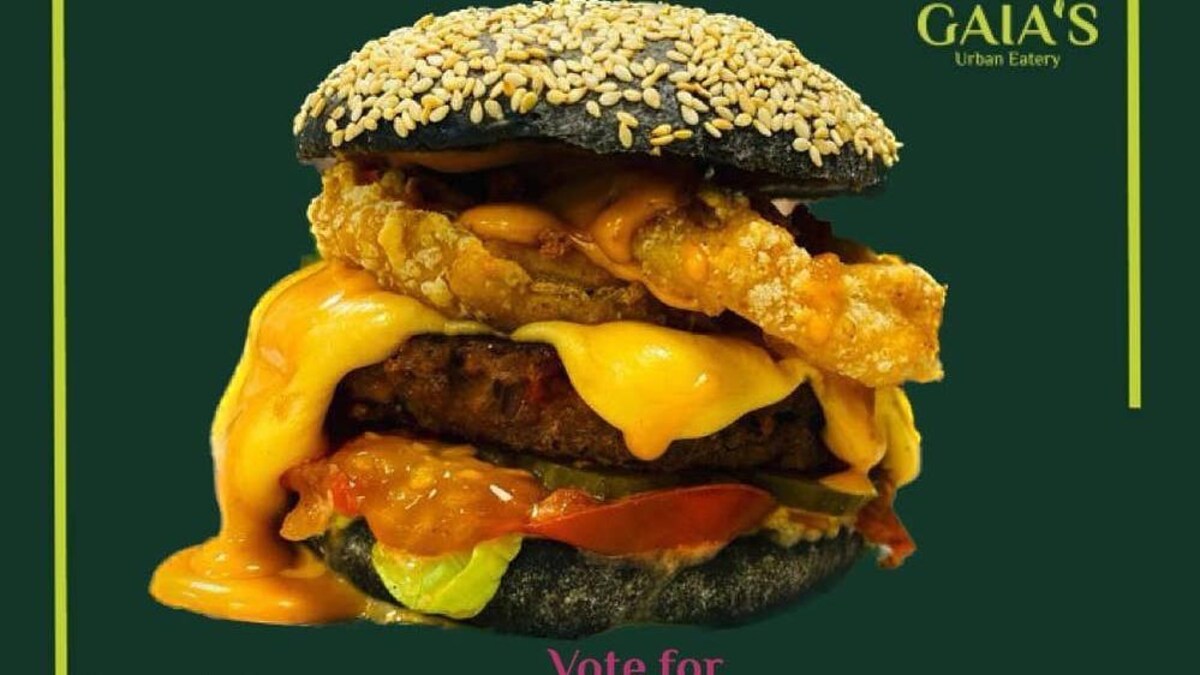 Une affiche montrant un burger dont le fromage dégouline.