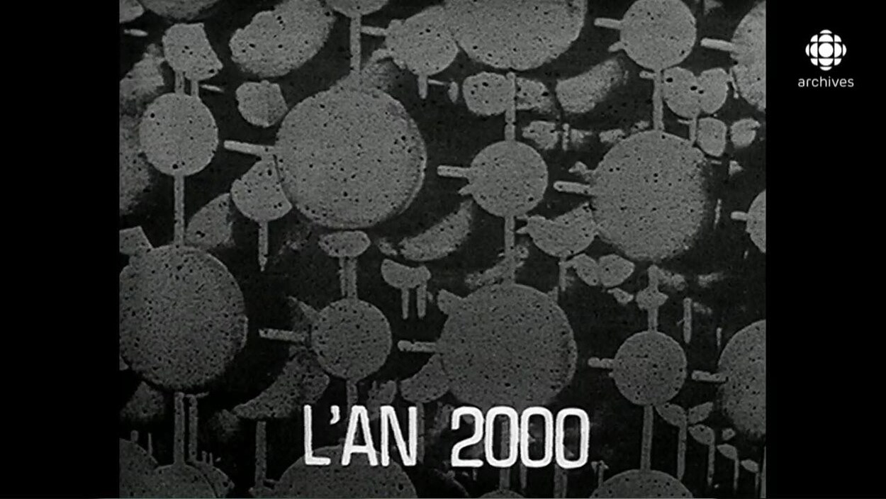 Illustration d'atomes groupés avec au bas le titre « L'AN 2000 ».