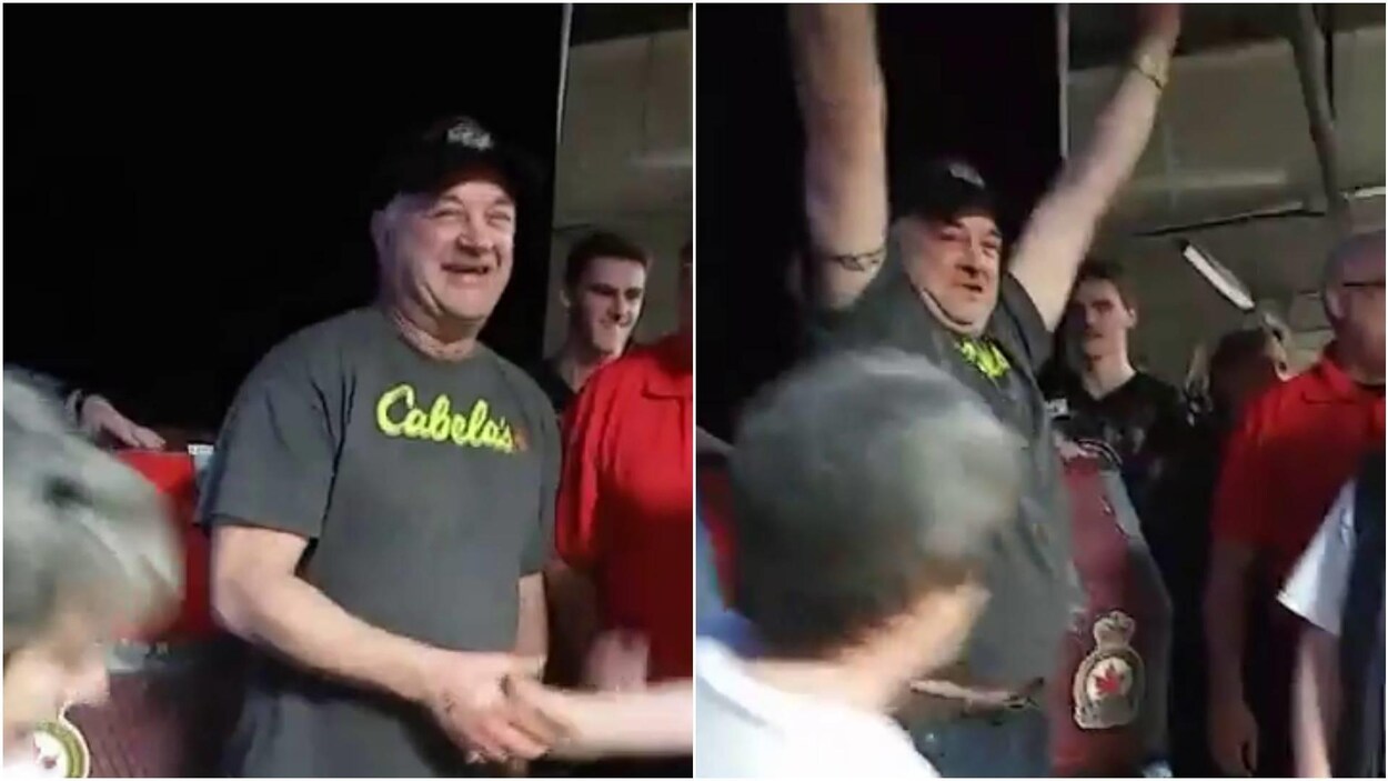 Brad Slugoski qui a remporté le gros lot de la loterie Chase the Ace lève les bras au milieu de la foule Brad Slugoski qui a remporté le gros lot de la loterie Chase the Ace lève les bras au milieu de la foule