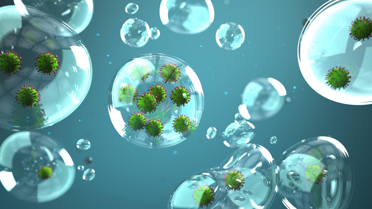 Représentation artistique montrant le coronavirus dans des gouttelettes de salive.