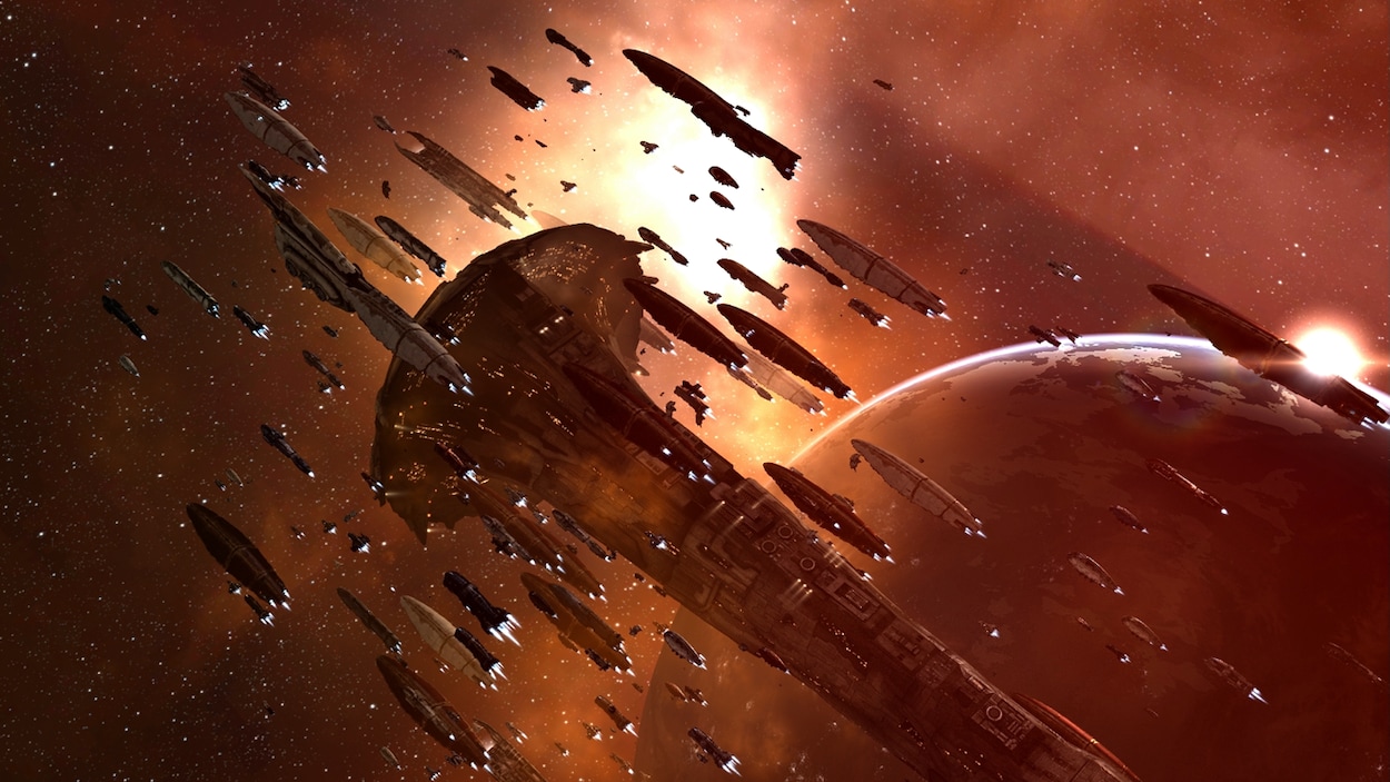 Une capture d'écran d'Eve Online montrant une flotte de vaisseaux spatiaux de différentes taille en formation au-dessus d'une planète. Une capture d'écran d'Eve Online montrant une flotte de vaisseaux spatiaux de différentes taille en formation au-dessus d'une planète.
