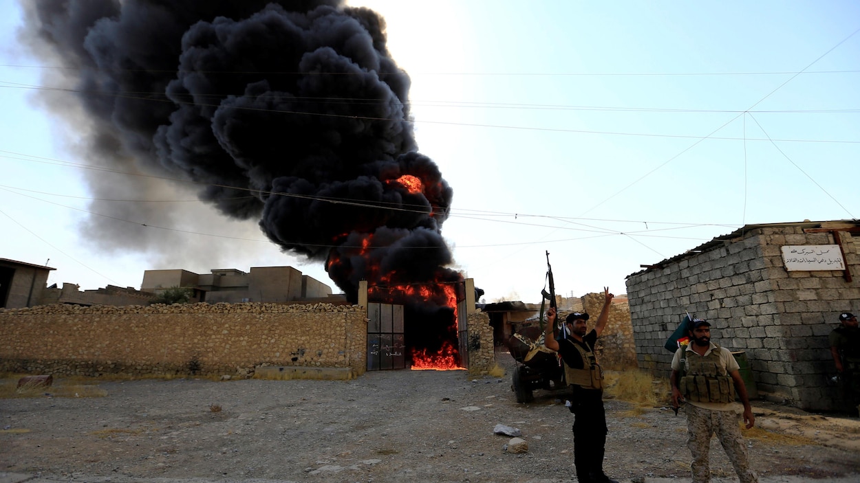 Des soldats de l’armée irakienne célèbrent la reprise de Tal Afar, le 30 août 2017.
Des soldats de l’armée irakienne célèbrent la reprise de Tal Afar, le 30 août 2017.