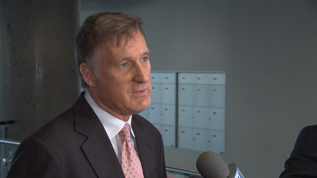 Maxime Bernier, lors d'une mêlée de presse.