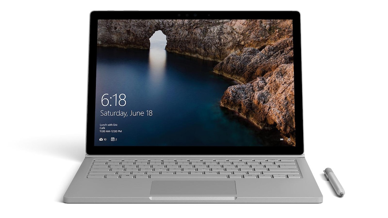 Une photo d'un ordinateur portable Microsoft Surface Book gris. Une photo d'un ordinateur portable Microsoft Surface Book gris.