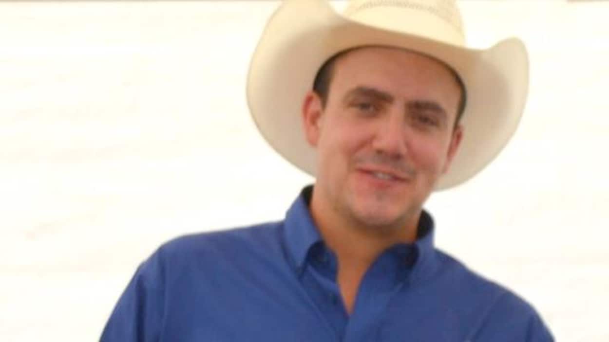 portrait de James Hargrave souriant et portant un chapeau de cowboy