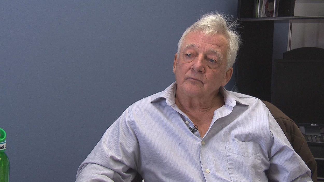 Michel Lemay assis dans son bureau