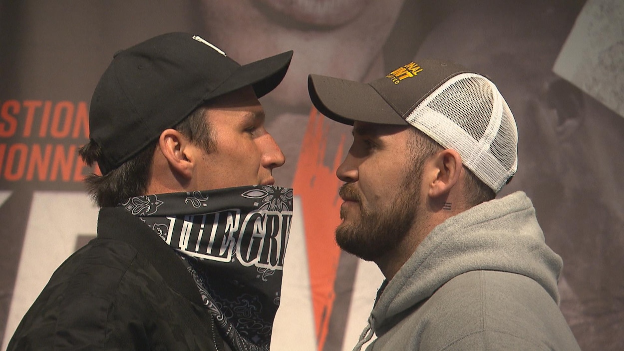 Le visage des deux boxeurs face à face.